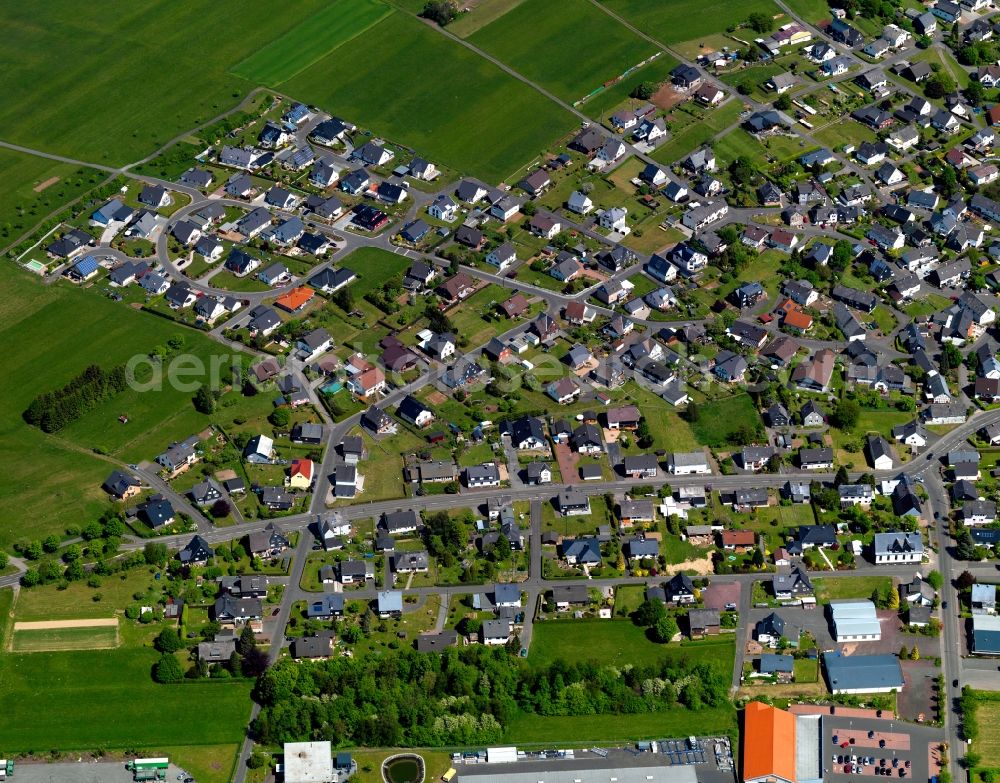 Aerial photograph Weitefeld - View of Weitefeld in the state of Rhineland-Palatinate. The borough and municipiality Weitefeld is located in the county district of Altenkirchen in the Westerwald forest region and surrounded by fields, meadows and forest. It sits on a hill