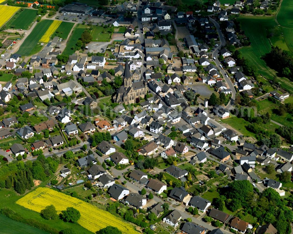 Welling from above - View of Welling in the state of Rhineland-Palatinate. The agricultural borough and municipiality is located in the county district of Mayen-Koblenz, above the Valley of the river Nette, and is surrounded by meadows and rapeseed fields