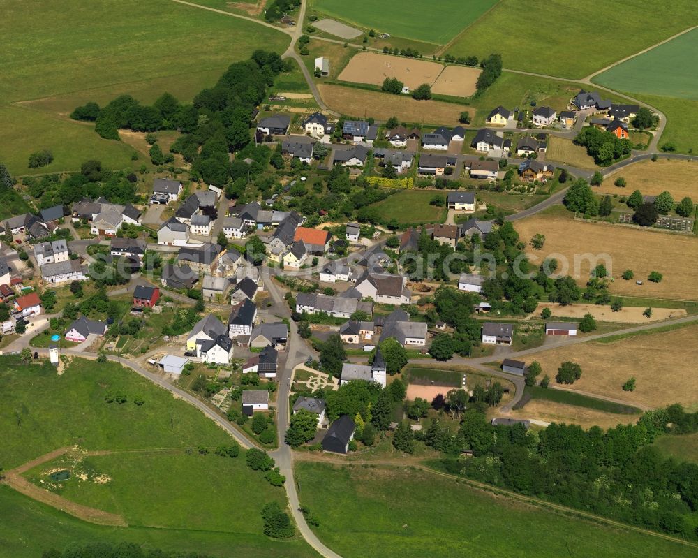 Wickenrodt from the bird's eye view: View of Wickenrodt in the state of Rhineland-Palatinate. The borough and municipiality is located in the county district of Birkenfeld, on a plateau above Hahnenbach Valley in the Hunsrueck region. It is surrounded by agricultural land, meadows and forest