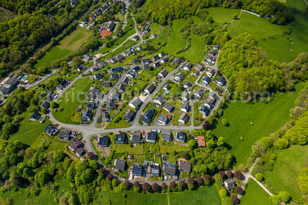 Brilon from the bird's eye view: Town View of the streets and houses of the residential areas in the district Messinghausen in Brilon in the state North Rhine-Westphalia