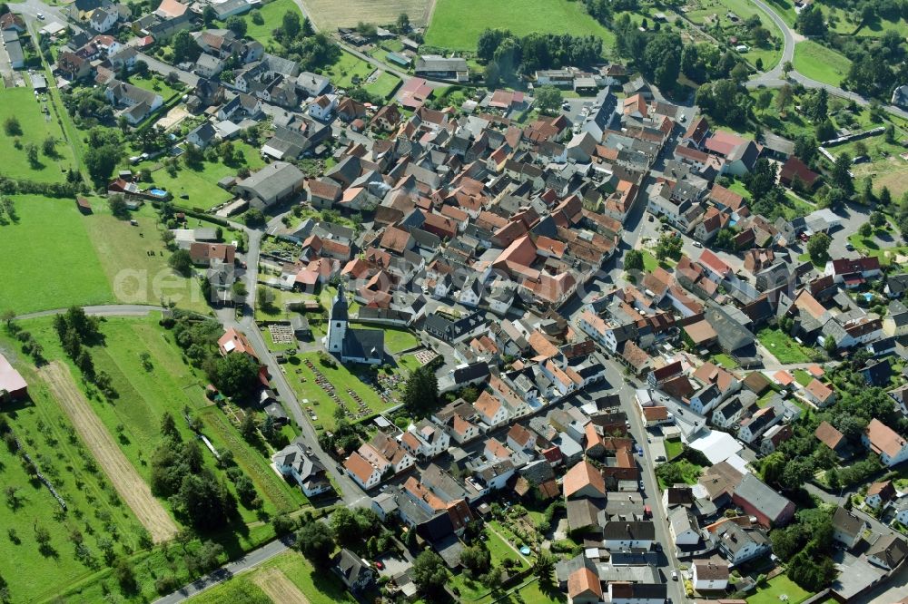 Aerial photograph Lich - Town View of the streets and houses of the residential areas in the district Muschenheim in Lich in the state Hesse, Germany