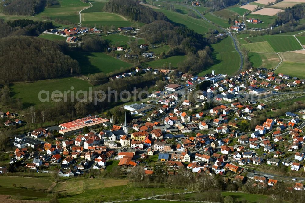 Poppenhausen (Wasserkuppe) from above - Town view on the edge of agricultural fields, usable areas and forests in Poppenhausen (Wasserkuppe) in the state Hesse, Germany