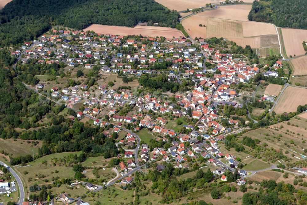 Adelsberg from the bird's eye view: Village view on the edge of agricultural fields and land in Adelsberg in the state Bavaria, Germany