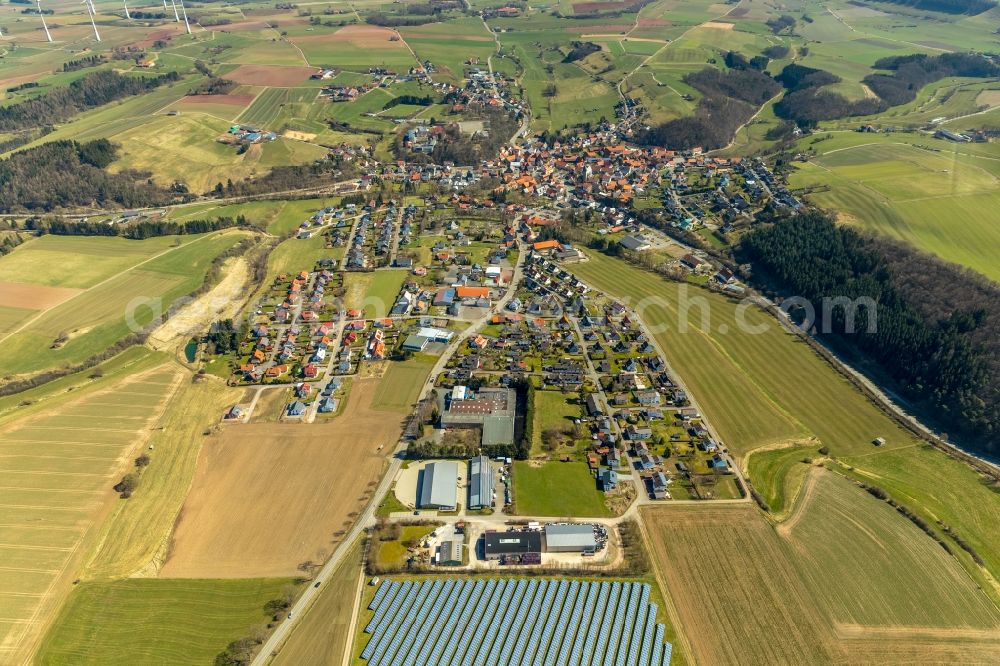 Adorf from above - Village view on the edge of agricultural fields and land along the Flechtdorfer Strasse in Adorf in the state Hesse, Germany