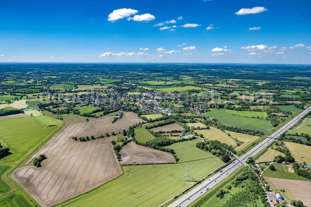 Aerial image Alveslohe - Village view on the edge of agricultural fields and land in Alveslohe in the state Schleswig-Holstein, Germany