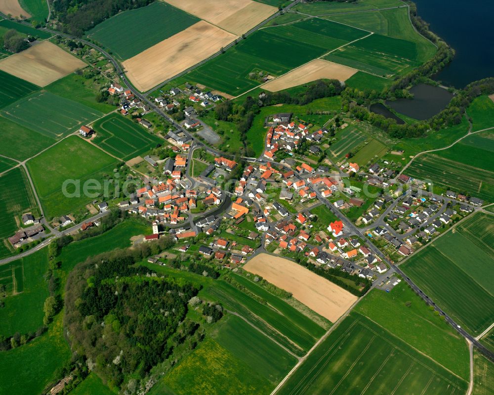 Aerial image Angenrod - Village view on the edge of agricultural fields and land in Angenrod in the state Hesse, Germany