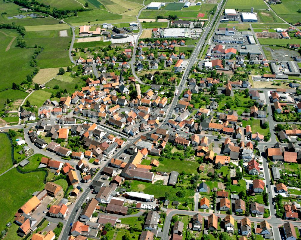 Angersbach from above - Village view on the edge of agricultural fields and land in Angersbach in the state Hesse, Germany