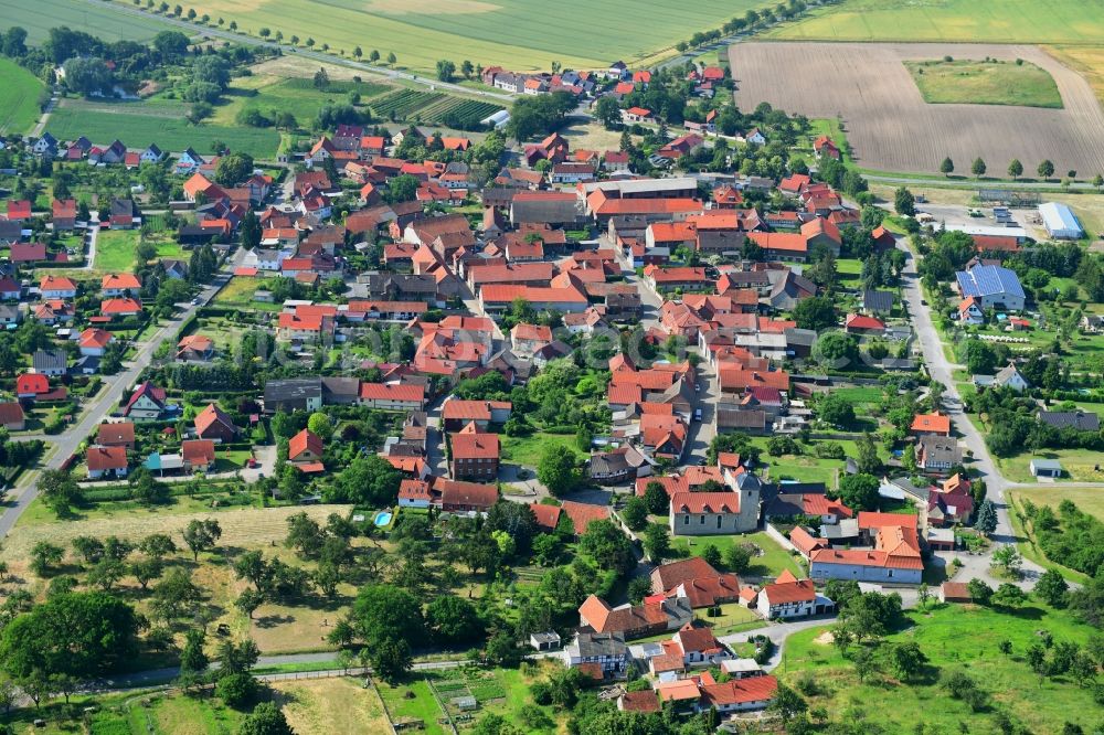 Aspenstedt from the bird's eye view: Village view on the edge of agricultural fields and land in Aspenstedt in the state Saxony-Anhalt, Germany