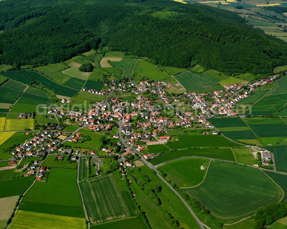 Ausbach from the bird's eye view: Village view on the edge of agricultural fields and land in Ausbach in the state Hesse, Germany