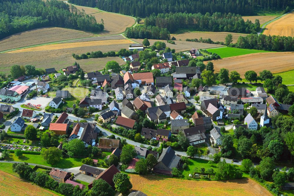 Azendorf from above - Village view on the edge of agricultural fields and land in Azendorf in the state Bavaria, Germany