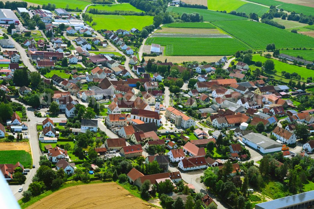 Bachhagel from the bird's eye view: Village view on the edge of agricultural fields and land on street Rosenstrasse in Bachhagel in the state Bavaria, Germany