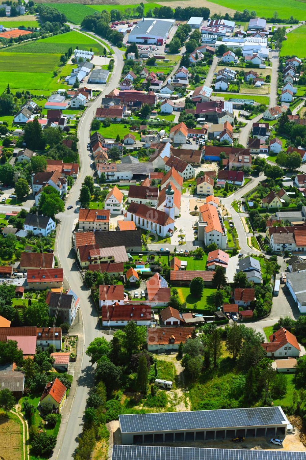 Aerial image Bachhagel - Village view on the edge of agricultural fields and land on street Rosenstrasse in Bachhagel in the state Bavaria, Germany