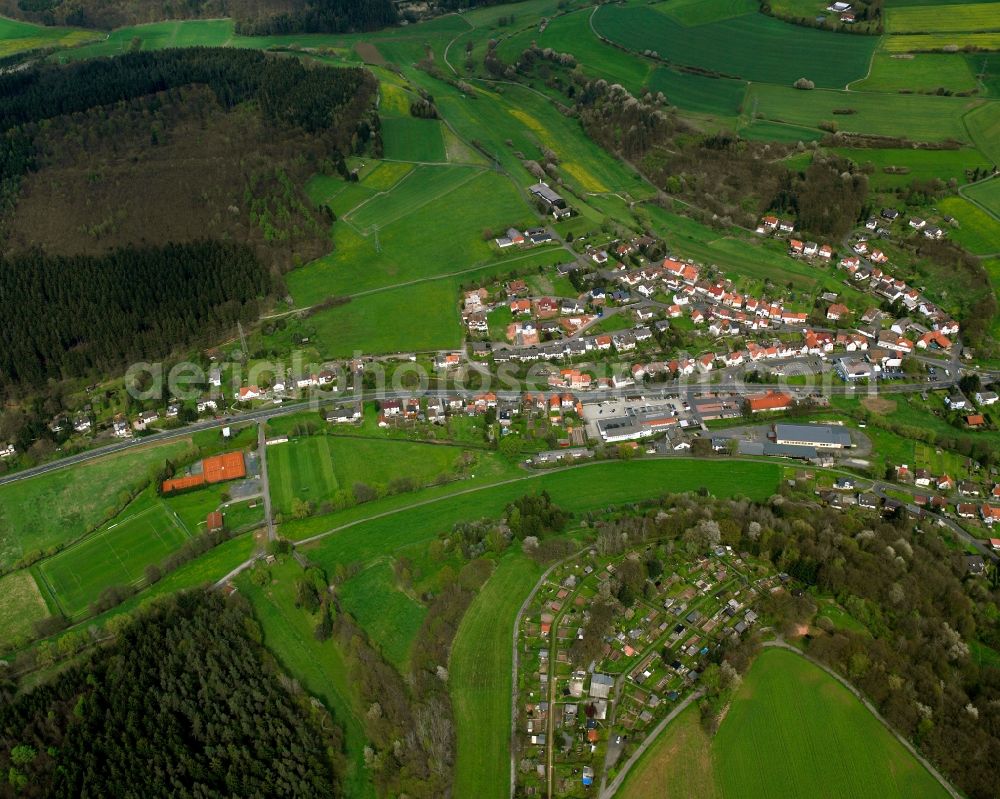 Bad Hersfeld from the bird's eye view: Village view on the edge of agricultural fields and land in Bad Hersfeld in the state Hesse, Germany