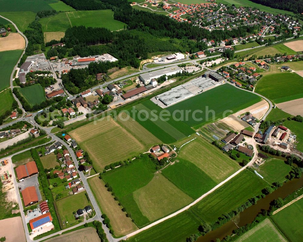 Linden from above - Village view on the edge of agricultural fields and land on Bahnhofstrasse in Linden in the state Bavaria, Germany