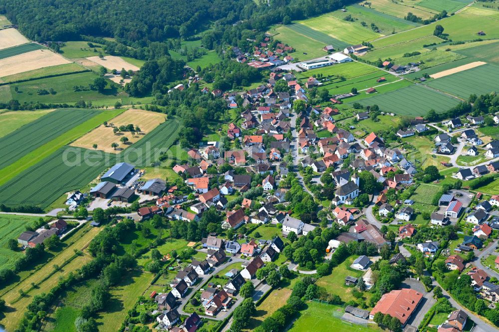 Bellersen from the bird's eye view: Village view on the edge of agricultural fields and land in Bellersen in the state North Rhine-Westphalia, Germany