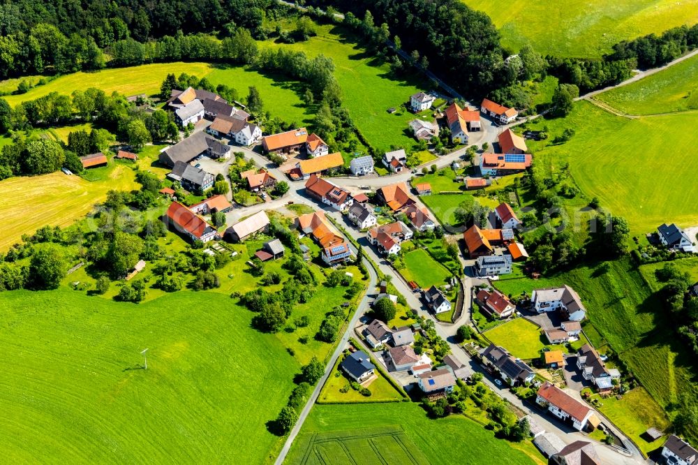 Benkhausen from above - Village view on the edge of agricultural fields and land in Benkhausen in the state Hesse, Germany