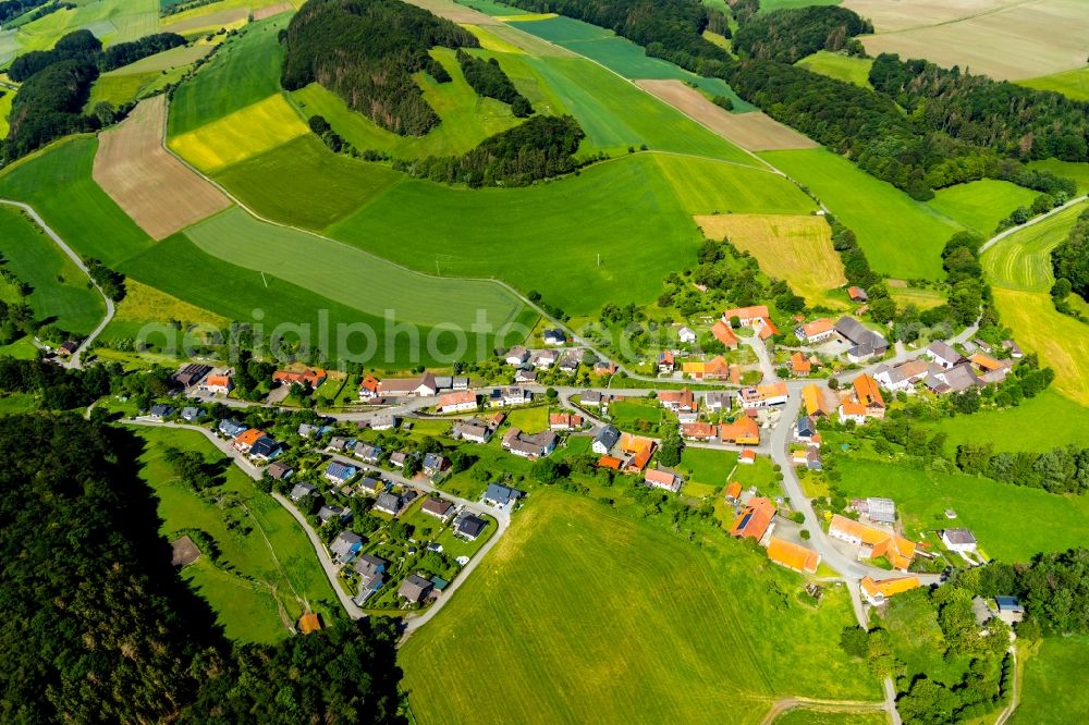 Benkhausen from above - Village view on the edge of agricultural fields and land in Benkhausen in the state Hesse, Germany