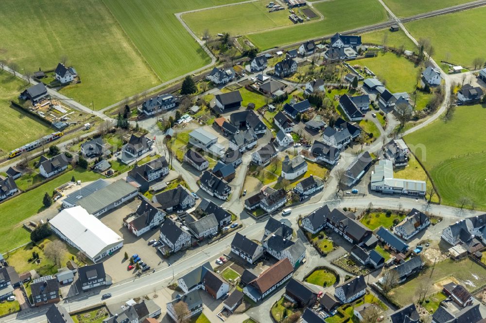 Aerial photograph Berghausen - Village view on the edge of agricultural fields and land on street Berghaeuser Strasse in Berghausen in the state North Rhine-Westphalia, Germany