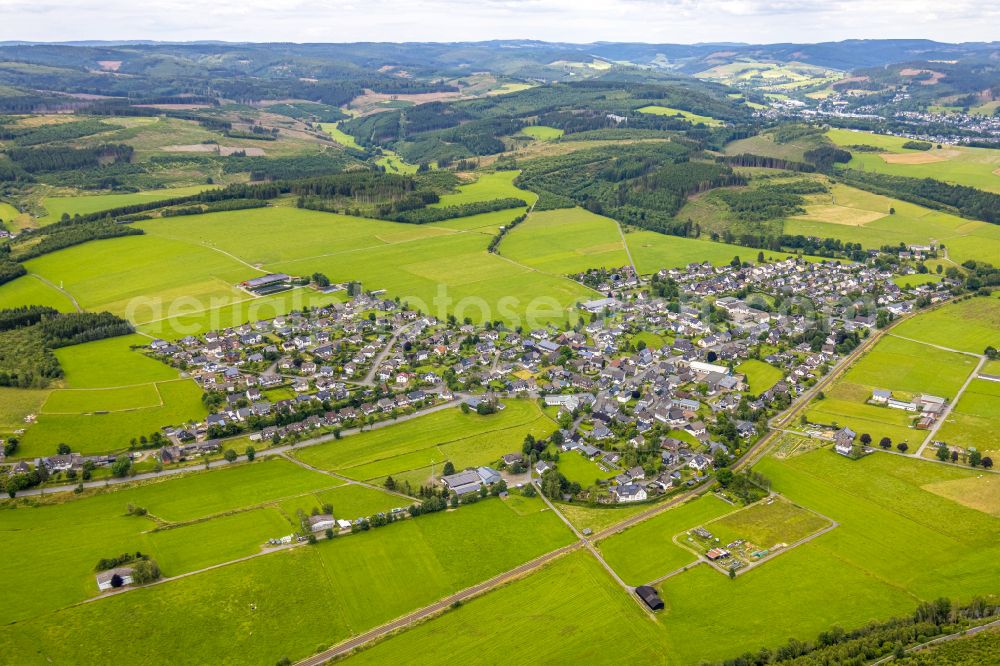 Aerial photograph Berghausen - Village view on the edge of agricultural fields and land on street Berghaeuser Strasse in Berghausen in the state North Rhine-Westphalia, Germany