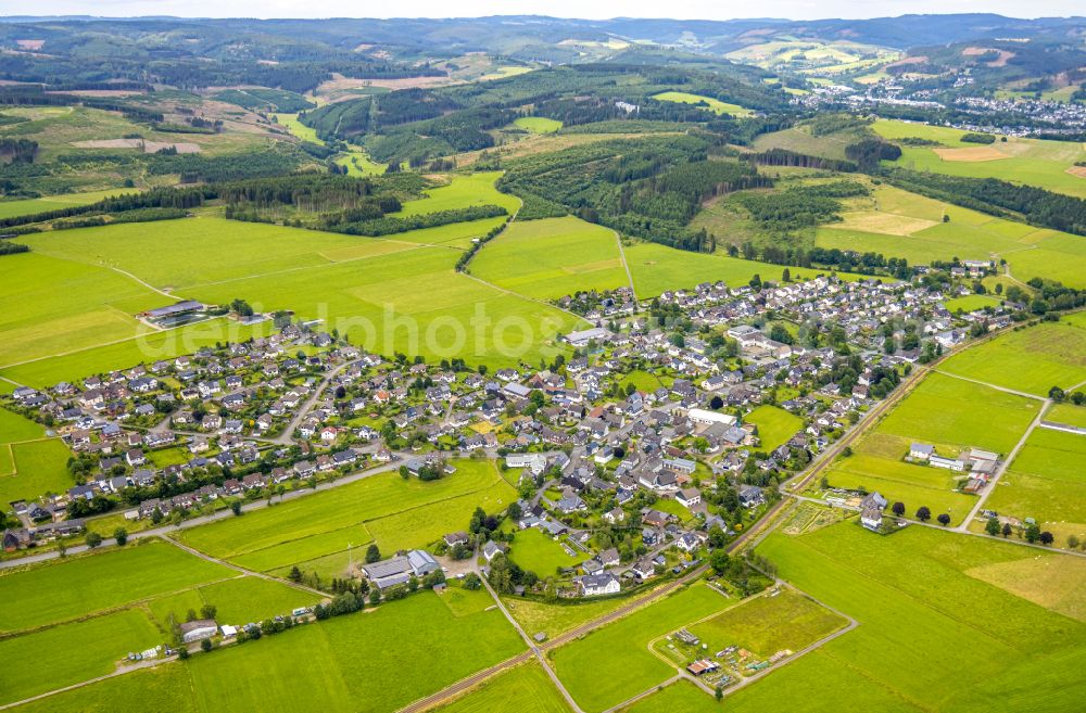 Berghausen from the bird's eye view: Village view on the edge of agricultural fields and land on street Berghaeuser Strasse in Berghausen in the state North Rhine-Westphalia, Germany