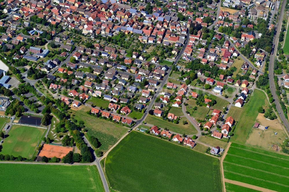 Aerial image Bergtheim - Village view on the edge of agricultural fields and land in Bergtheim in the state Bavaria, Germany