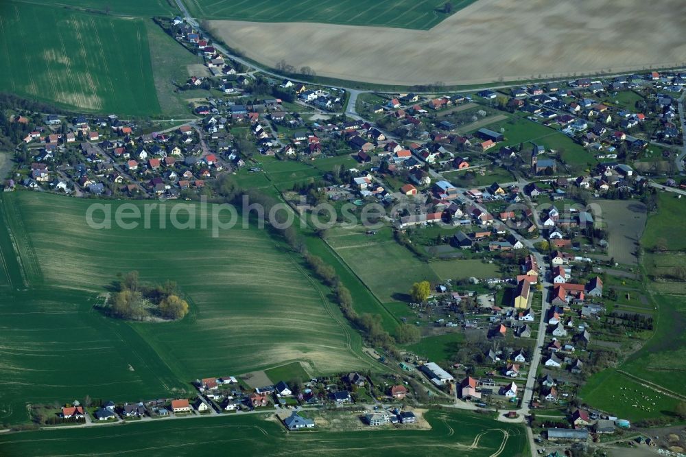 Aerial image Berkholz-Meyenburg - Village view on the edge of agricultural fields and land in Berkholz-Meyenburg in the state Brandenburg, Germany