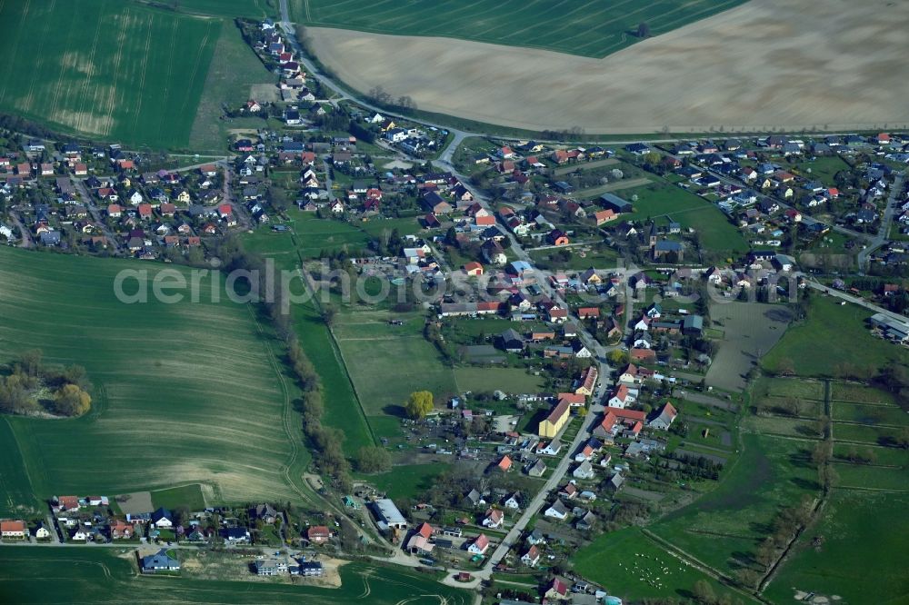 Berkholz-Meyenburg from the bird's eye view: Village view on the edge of agricultural fields and land in Berkholz-Meyenburg in the state Brandenburg, Germany