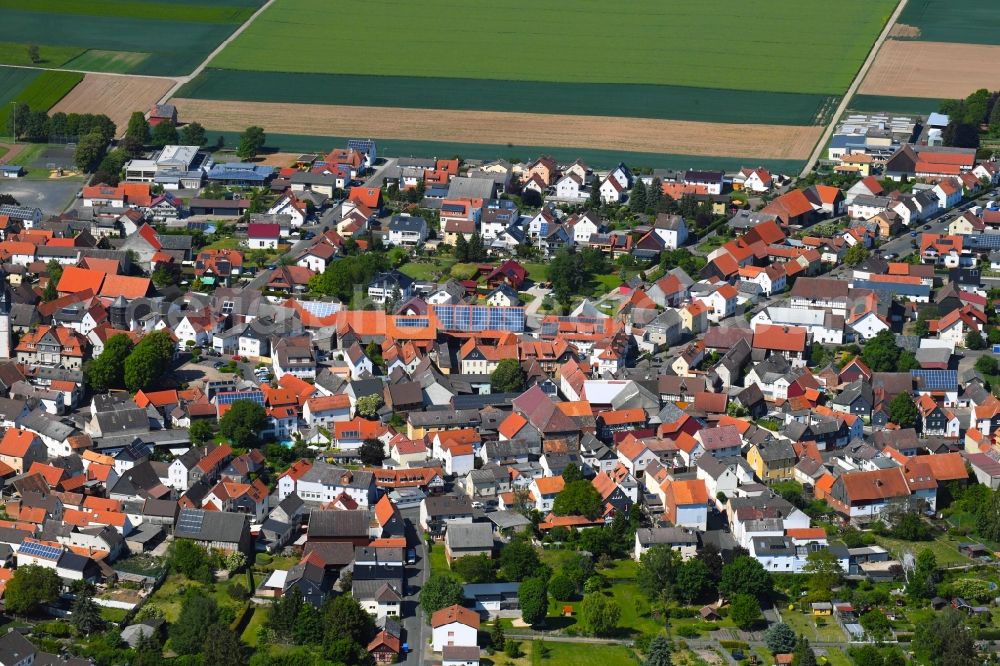 Berstadt from the bird's eye view: Village view on the edge of agricultural fields and land in Berstadt in the state Hesse, Germany