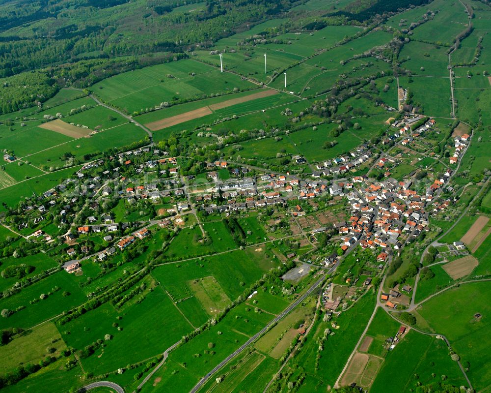 Aerial image Betzenrod - Village view on the edge of agricultural fields and land in Betzenrod in the state Hesse, Germany