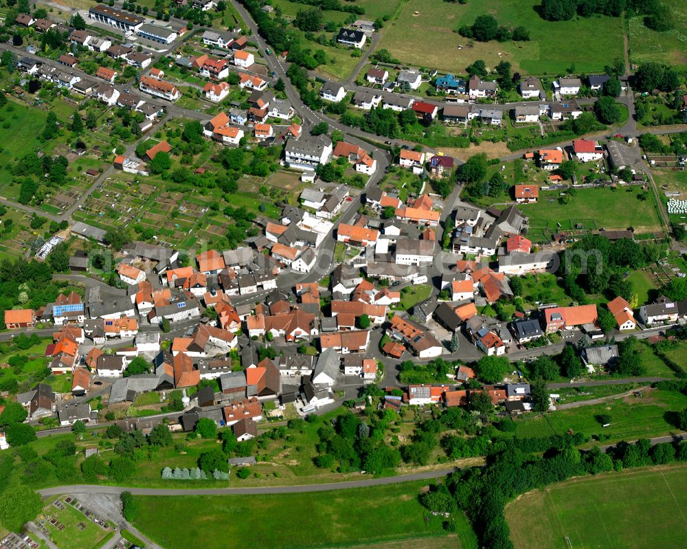 Betzenrod from above - Village view on the edge of agricultural fields and land in Betzenrod in the state Hesse, Germany