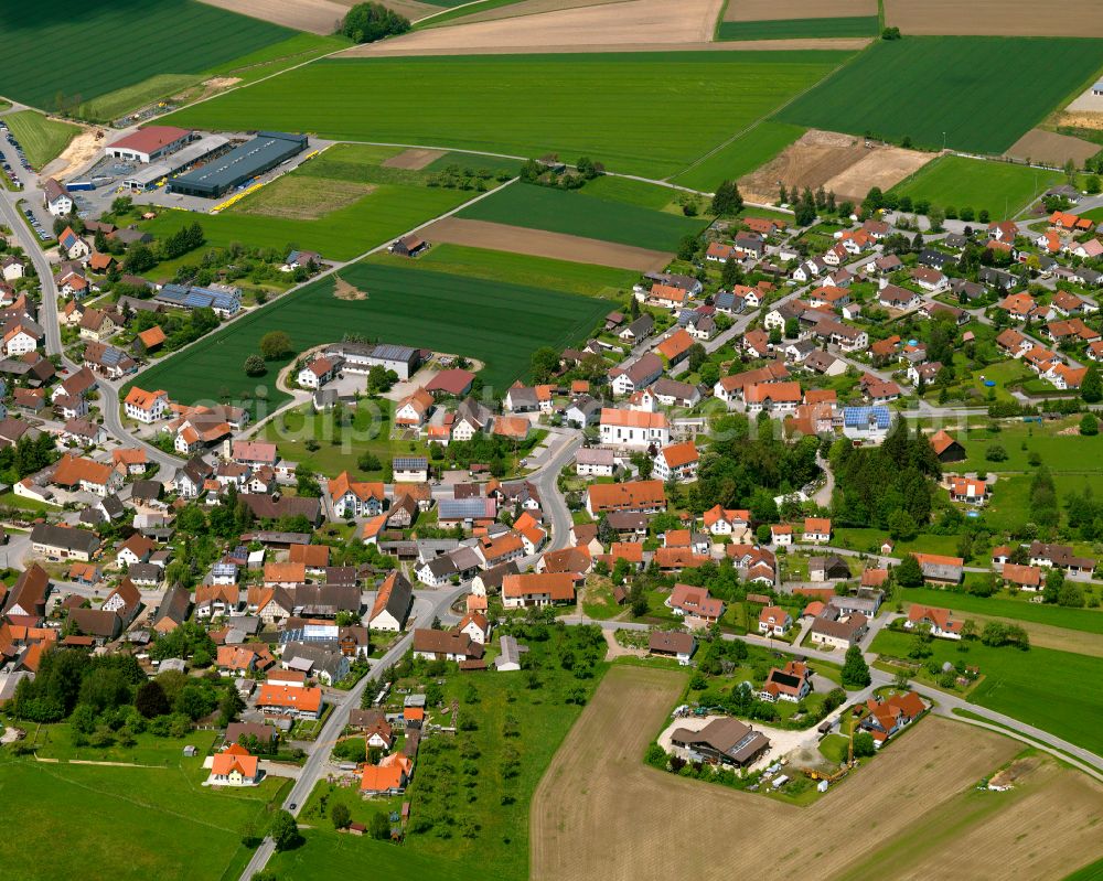 Aerial image Betzenweiler - Village view on the edge of agricultural fields and land in Betzenweiler in the state Baden-Wuerttemberg, Germany