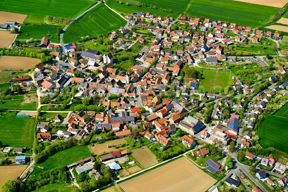 Bibergau from above - Village view on the edge of agricultural fields and land in Bibergau in the state Bavaria, Germany