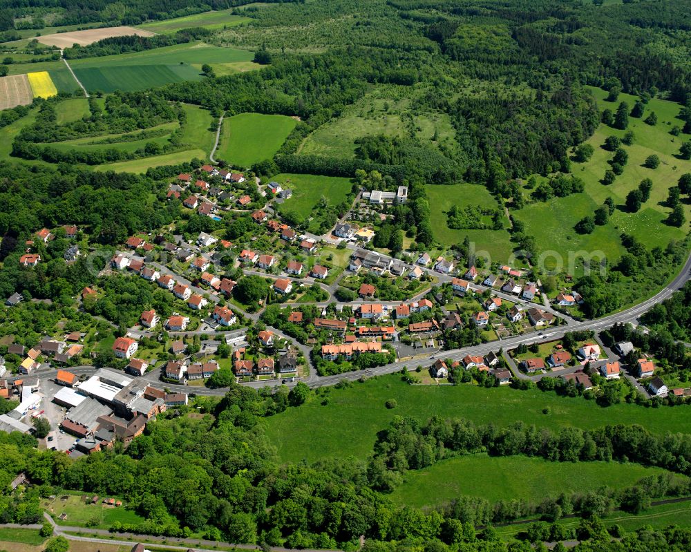 Blitzenrod from the bird's eye view: Village view on the edge of agricultural fields and land in Blitzenrod in the state Hesse, Germany