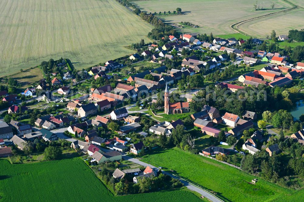 Bochow from the bird's eye view: Village view on the edge of agricultural fields and land in Bochow in the state Brandenburg, Germany