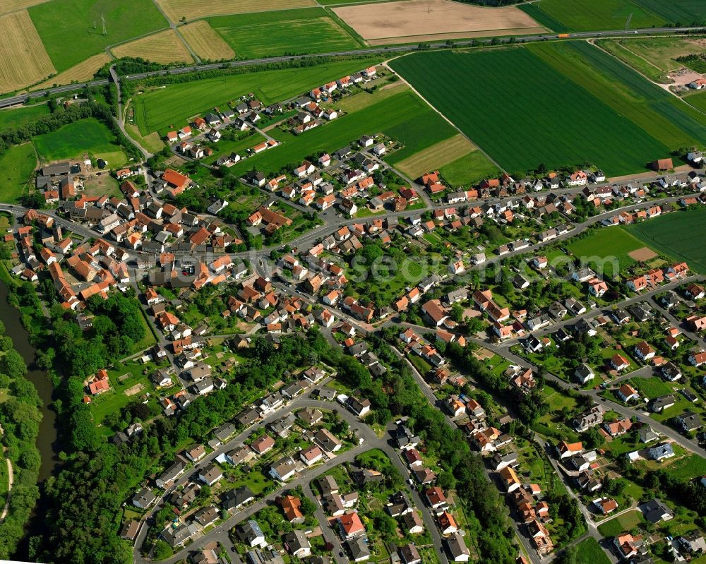 Breitenbach from above - Village view on the edge of agricultural fields and land in Breitenbach in the state Hesse, Germany