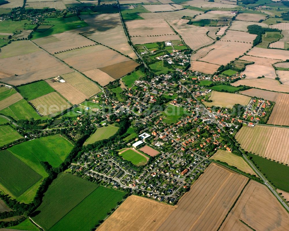 Breitenfelde from the bird's eye view: Village view on the edge of agricultural fields and land in Breitenfelde in the state Schleswig-Holstein, Germany