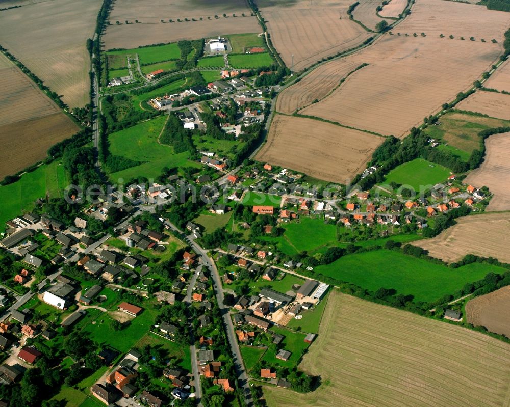 Aerial photograph Breitenfelde - Village view on the edge of agricultural fields and land in Breitenfelde in the state Schleswig-Holstein, Germany