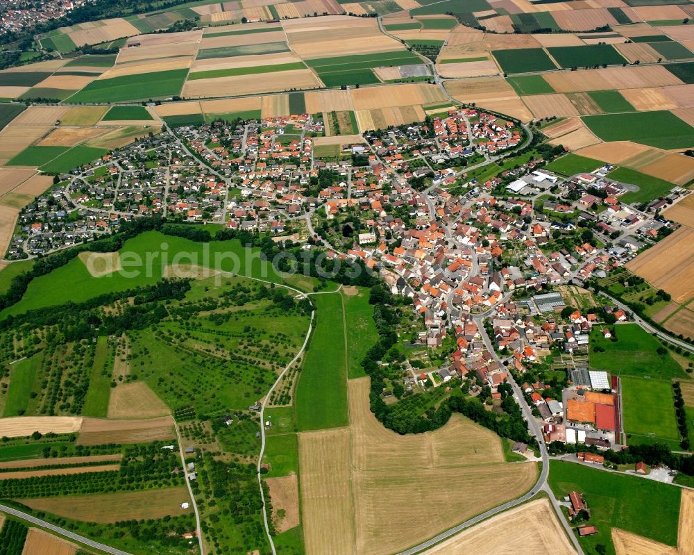 Brettach from above - Village view on the edge of agricultural fields and land in Brettach in the state Baden-Wuerttemberg, Germany