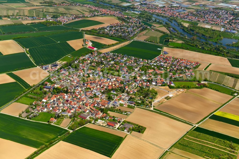 Buchbrunn from the bird's eye view: Village view on the edge of agricultural fields and land in Buchbrunn in the state Bavaria, Germany