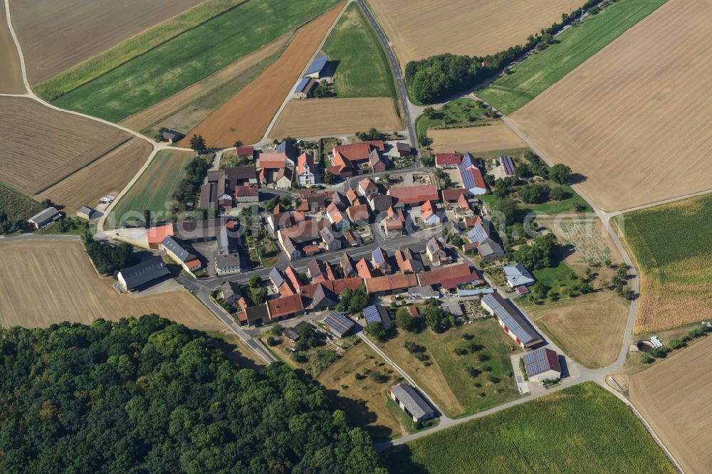 Aerial image Burgerroth - Village view on the edge of agricultural fields and land in Burgerroth in the state Bavaria, Germany