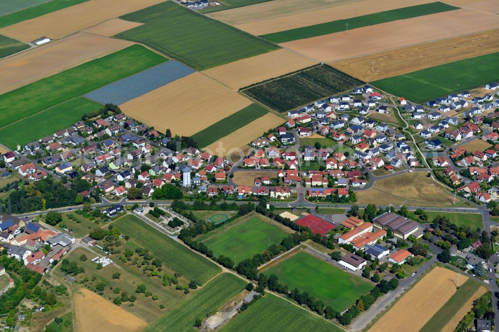 Aerial image Burggrumbach - Village view on the edge of agricultural fields and land in Burggrumbach in the state Bavaria, Germany