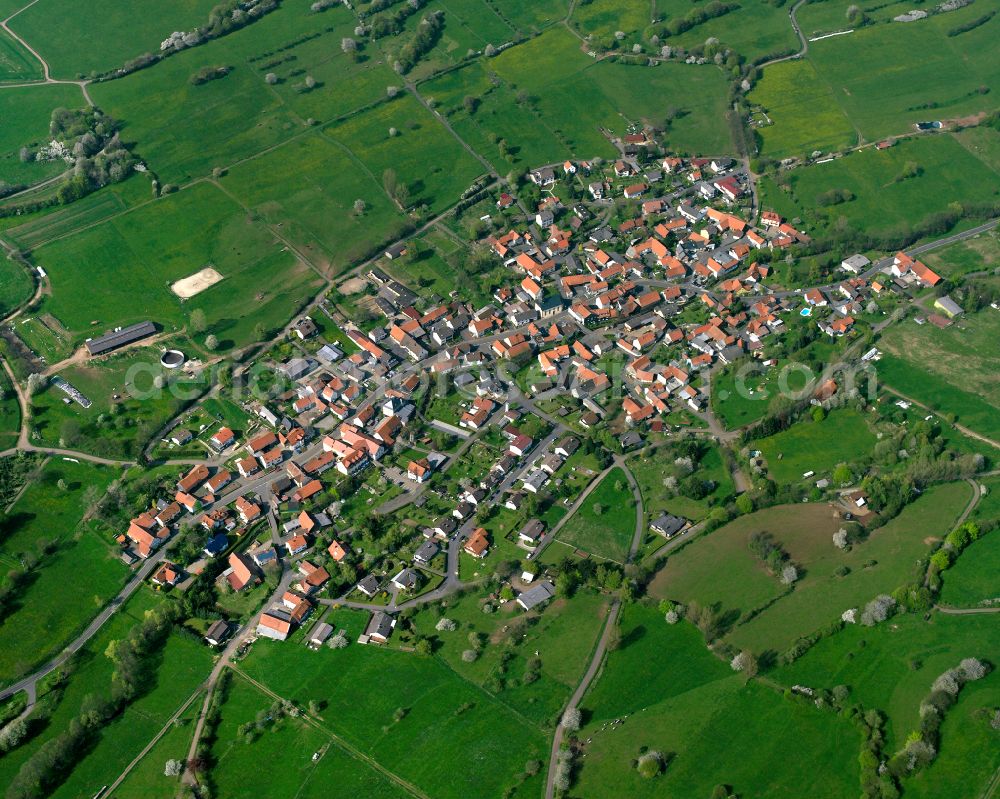 Burkhards from the bird's eye view: Village view on the edge of agricultural fields and land in Burkhards in the state Hesse, Germany