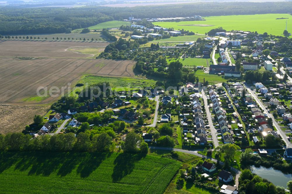 Burow from the bird's eye view: Village view on the edge of agricultural fields and land in Burow in the state Mecklenburg - Western Pomerania, Germany