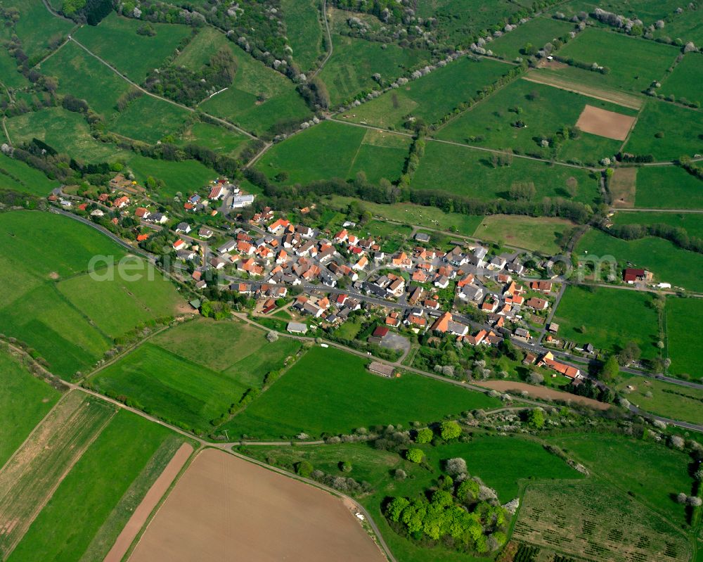 Busenborn from above - Village view on the edge of agricultural fields and land in Busenborn in the state Hesse, Germany