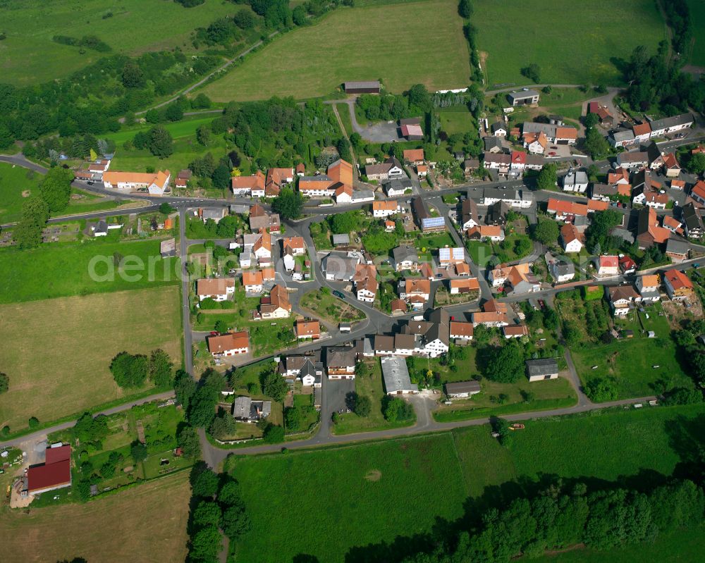 Busenborn from above - Village view on the edge of agricultural fields and land in Busenborn in the state Hesse, Germany