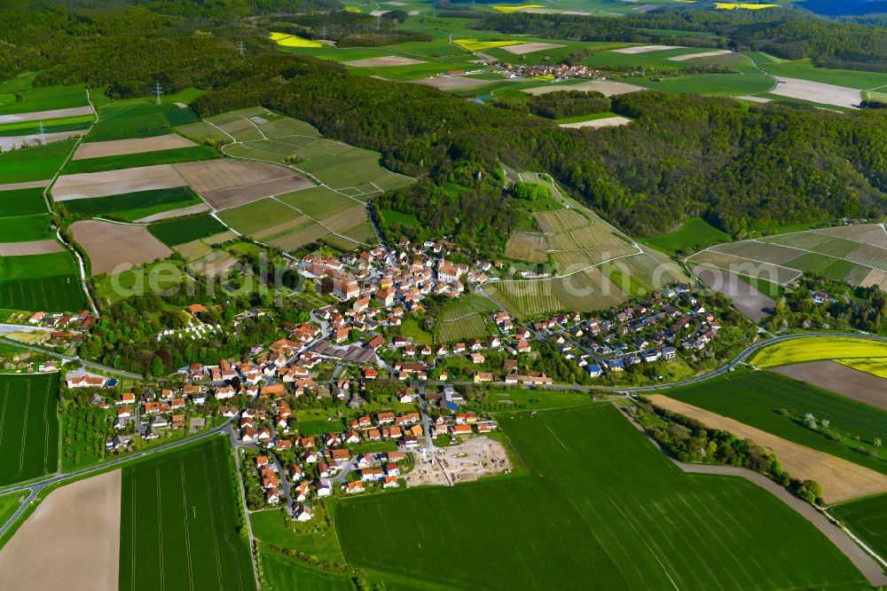 Castell from the bird's eye view: Village view on the edge of agricultural fields and land in Castell in the state Bavaria, Germany