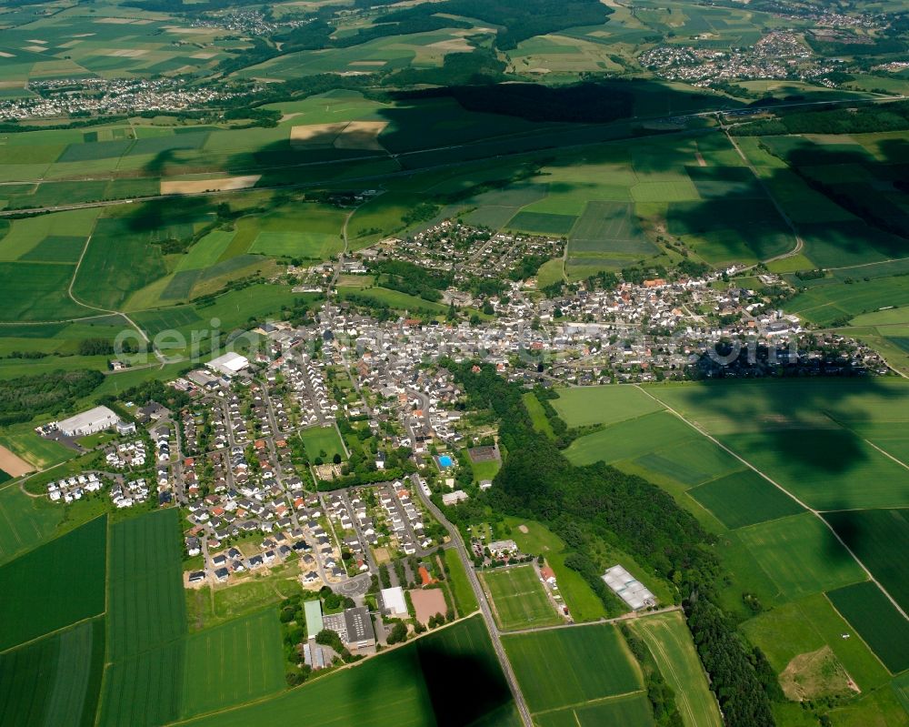 Aerial image Dauborn - Village view on the edge of agricultural fields and land in Dauborn in the state Hesse, Germany