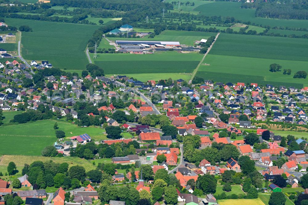 Debstedt from above - Village view on the edge of agricultural fields and land in Debstedt in the state Lower Saxony, Germany