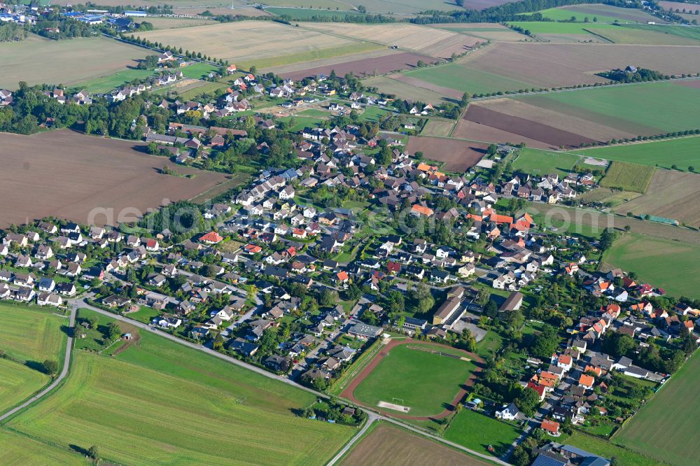 Aerial image Deensen - Village view on the edge of agricultural fields and land in Deensen in the state Lower Saxony, Germany