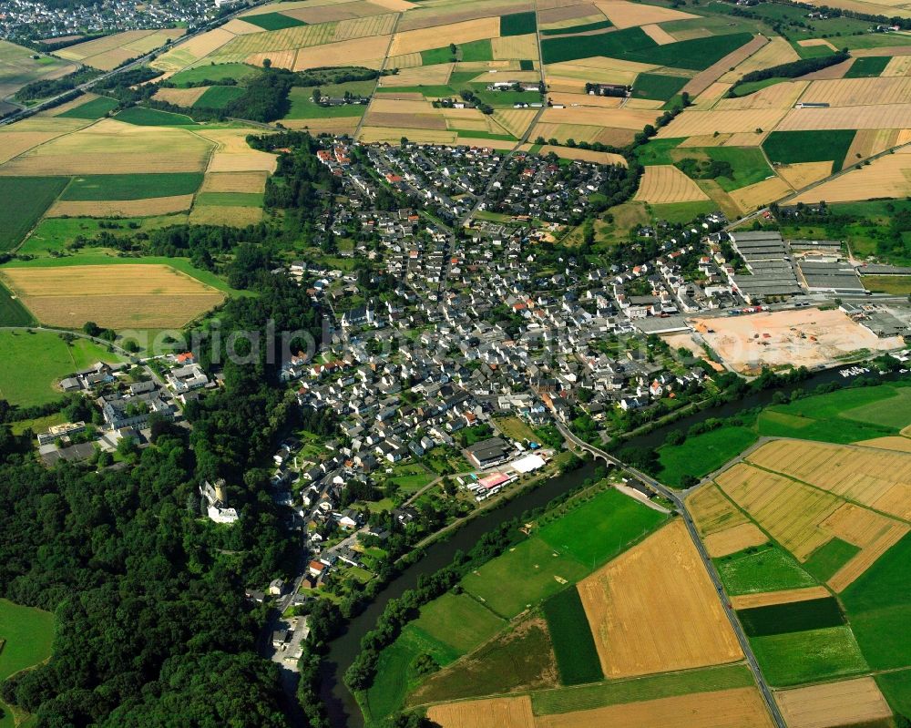 Dehrn from the bird's eye view: Village view on the edge of agricultural fields and land in Dehrn in the state Hesse, Germany